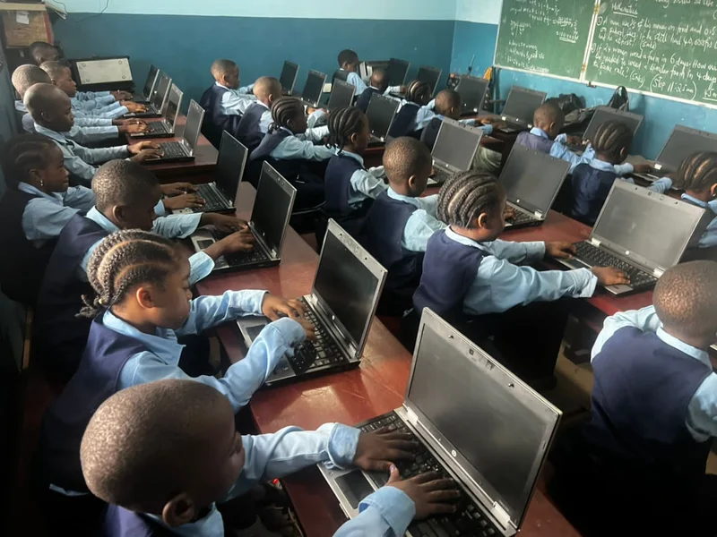 BGS students working at laptops in the ICT computer lab — Coding & Robotics programme