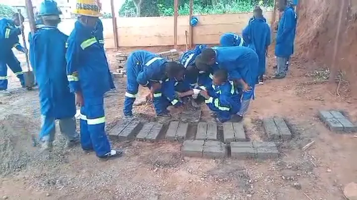 BGS technical students making bricks at the construction workshop